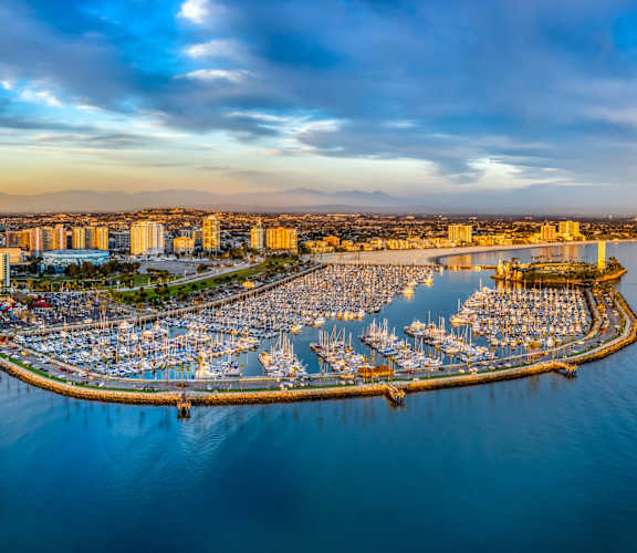 A beautiful aerial view of a city with a large body of water in the foreground.