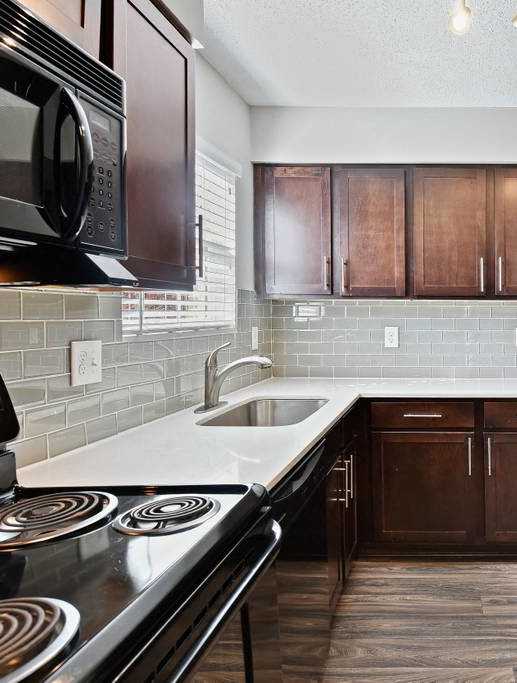 a kitchen with a sink and a counter top at The Ridge at Chenal Valley, Little Rock, Arkansas