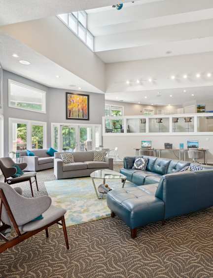 a living room with couches and a tv and a fireplace at University Ridge Apartments, Durham, North Carolina, 27707