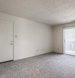 the preserve at ballantyne commons spacious living room with door to balcony