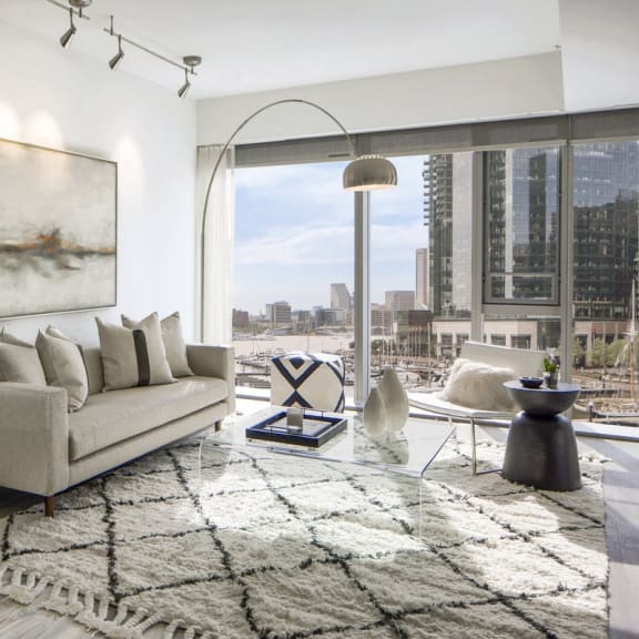 a living room with a couch and a view of the city at 1305 Dock Street, Maryland, 21231