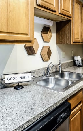 Granite Counter Tops In Kitchen at The Falgrove Apartments in Omaha, NE 68137