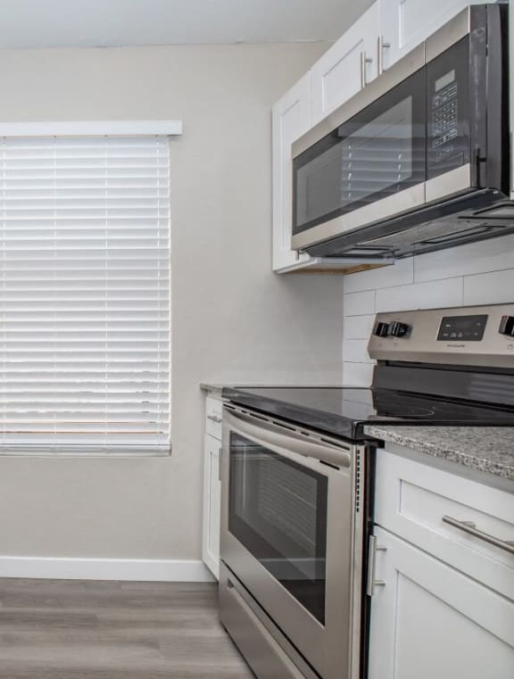 a kitchen with stainless steel appliances and a sink