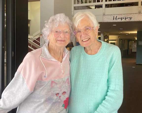 Two old women posing for picture at Hilltop Commons Senior Living, Grass Valley, 95945