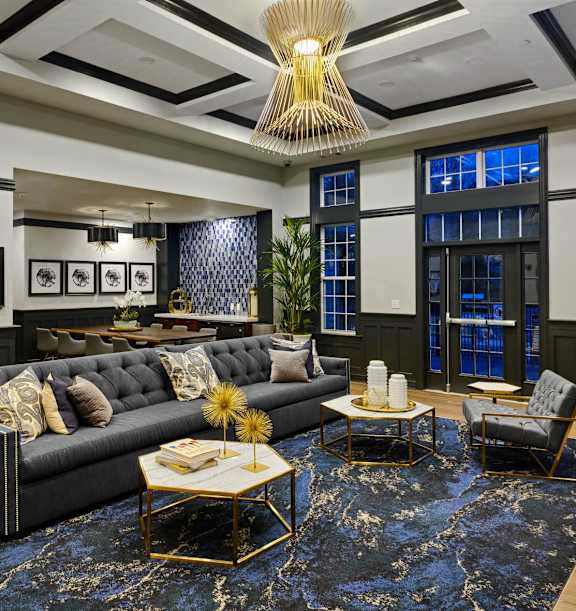 a living room with a couch and tables