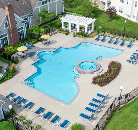  an aerial view of a large swimming pool in front of an apartment building in Indianapolis