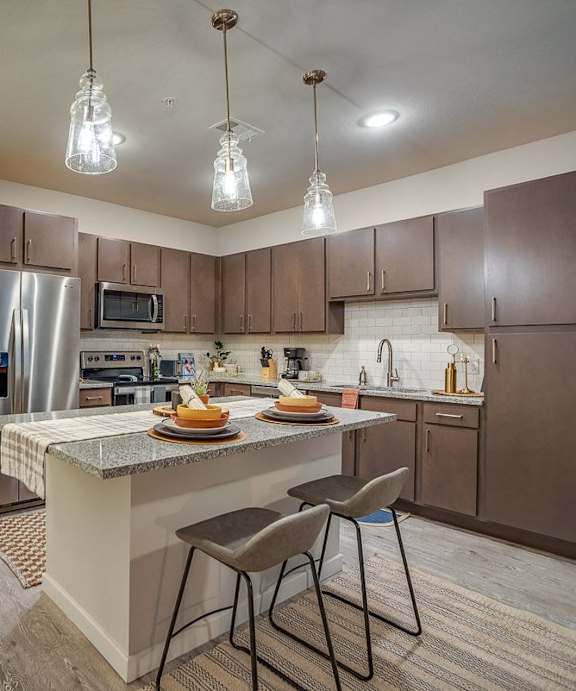 Discovery at the Realm Model Kitchen with Island and Appliances