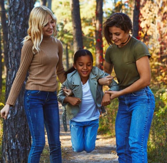 A couple of lesbian ladies having fun in the autumn with their teenage daughter