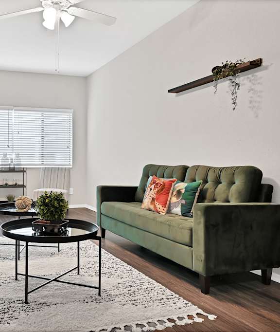 a living room with a couch and a coffee table and a fireplace