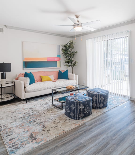 a living room with a white couch and a fireplace
