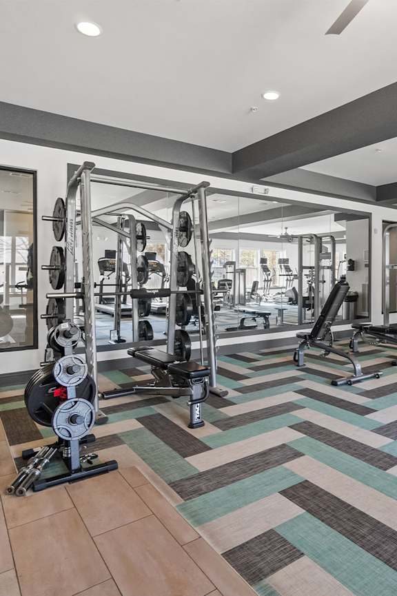 a workout room with treadmills and a tv at 1010 Dilworth Apartments, Charlotte, North Carolina
