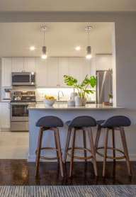 a kitchen and dining area in a 555 waverly unit