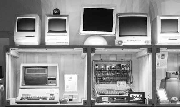 Display case filled with different types of computers