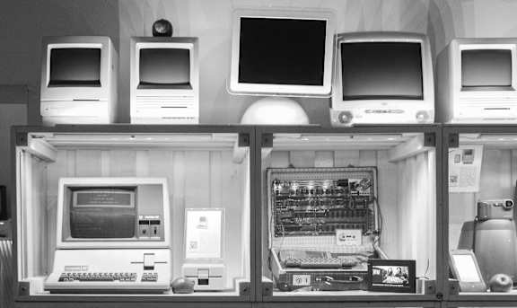 Display case filled with different types of computers