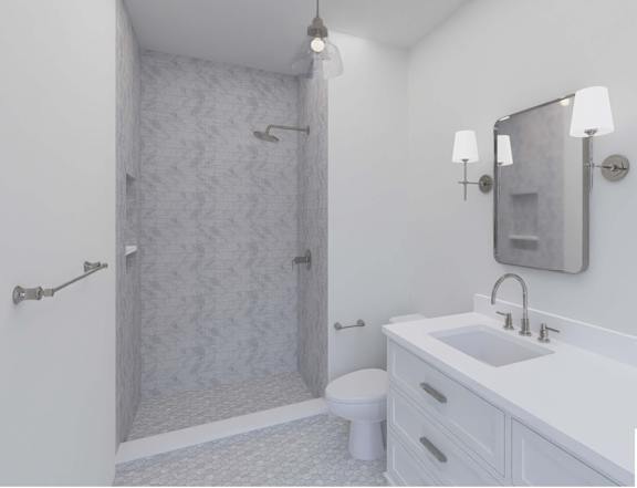 A white bathroom with a shower, toilet, and sink.