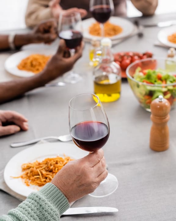 Friends Having Wine and Dinner Together
