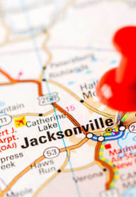 a red thumbtack on a map