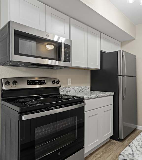 kitchen white cabinets stainless steel appliances