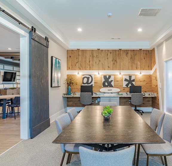 a dining room with a table and chairs and a large window  at Lullwater at Big Ridge, Hixson, TN, 37343