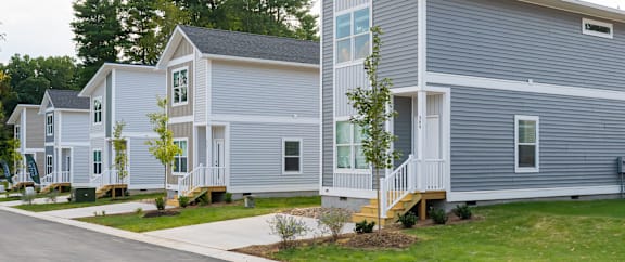 Charleston model homes at Belle Meadow in Asheville on a quiet suburban street.