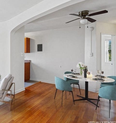 a living room with a couch and a table and a window