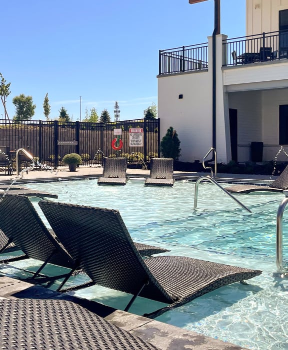 our resort style swimming pool is next to our building