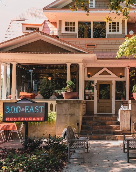A restaurant named 300 East is located in a house with a porch.