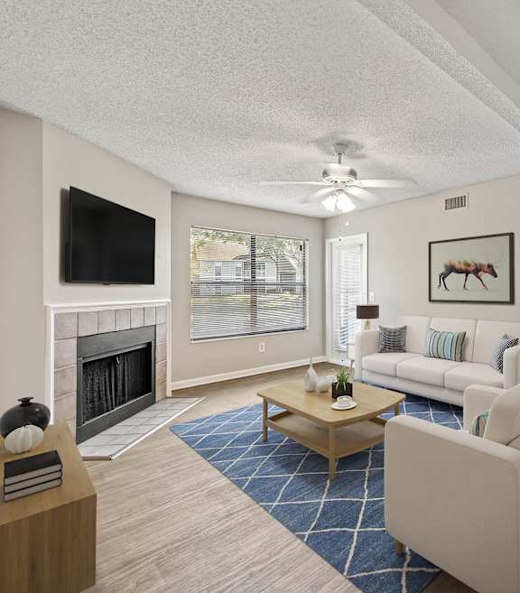 a living room filled with furniture and a large window