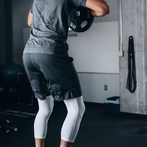 Man Working Out in Fitness Center