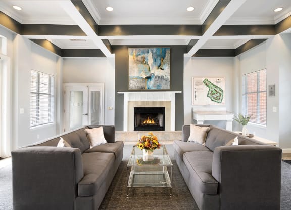 a living room with a large couch and a fireplace