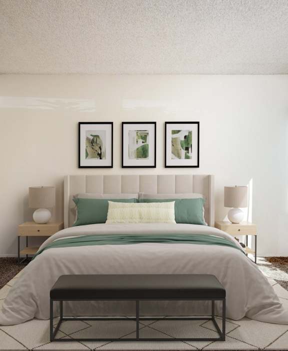 a bedroom with white walls and a bed with green pillows