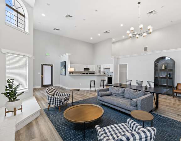 A living room with a grey couch and a wooden coffee table.at Eagles Edge Apartments, Indianapolis, IN 462542