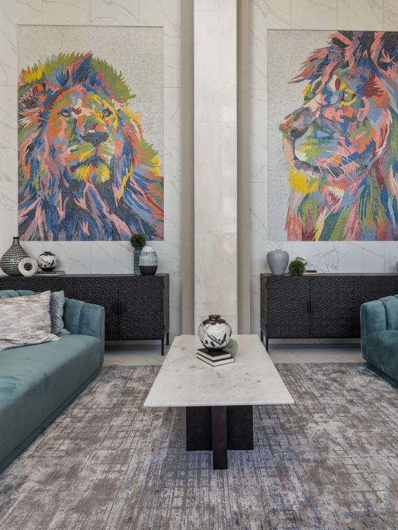 a living room filled with furniture and a large painting of a lion