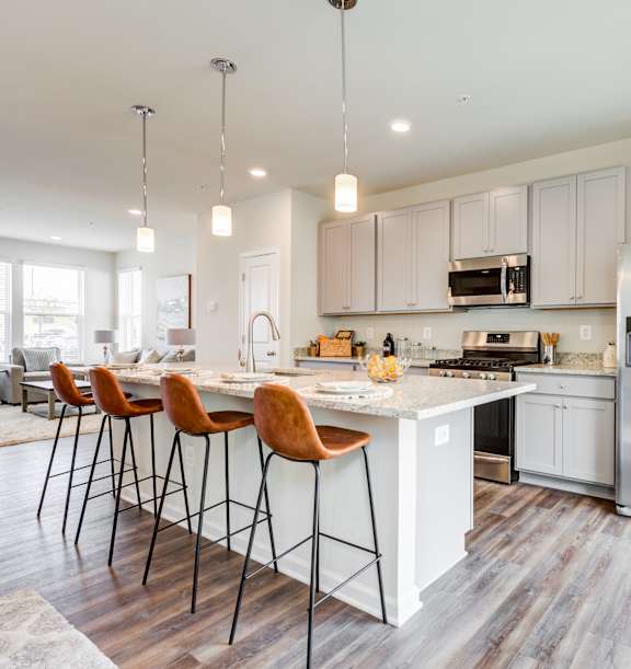 Kitchen with Large Island and Four Stools at Refinery Row in Baltimore, MD 21224