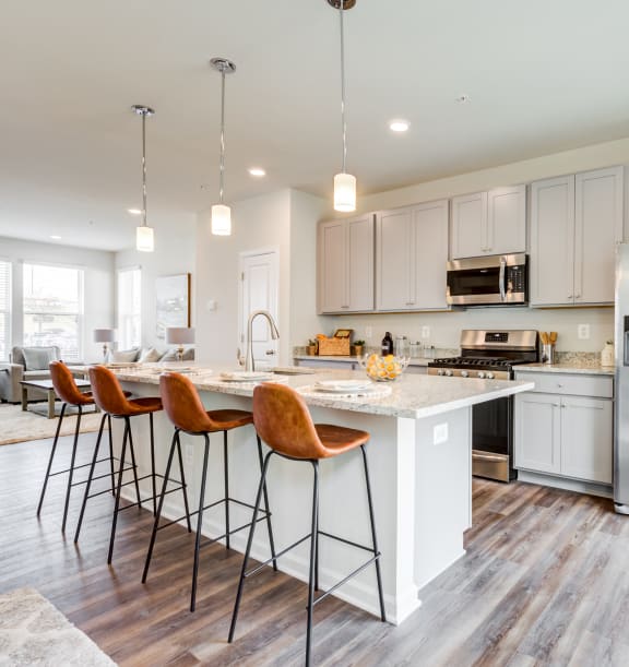 Kitchen with Large Island and Four Stools at Refinery Row in Baltimore, MD, 21224