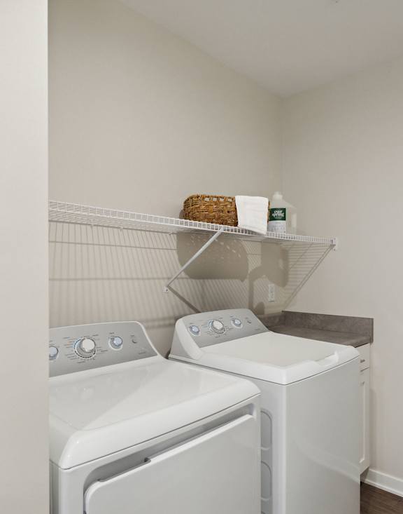 A laundry room with a washer and dryer.