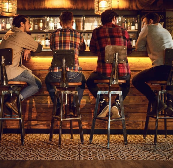 people sitting at a bar