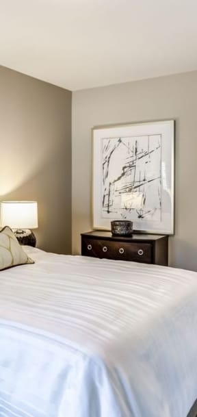 Bedroom with cozy bed and lamp at Apex 41, Lombard, IL, 60148
