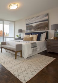 a bedroom with a large bed and a large window