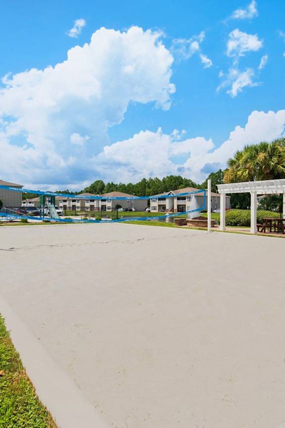 Sand pit beach volleyball court at Crystal Lake Apartment in Pensacola, FL