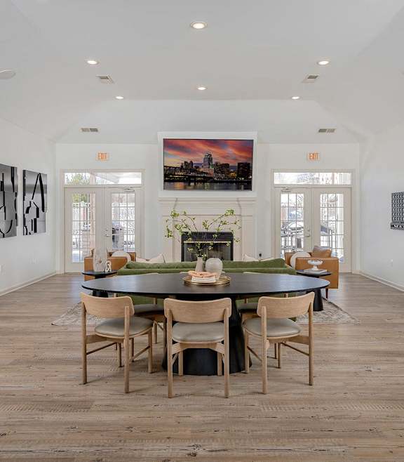 a large living room with couches and a table