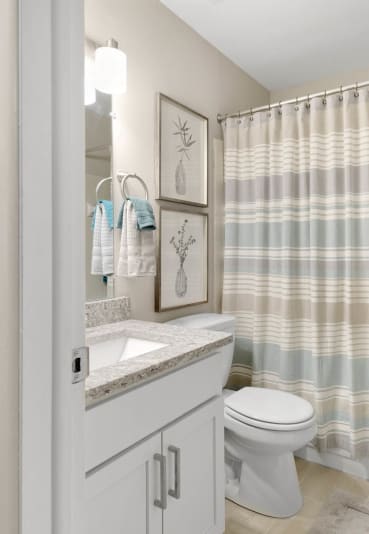 a bathroom with a shower and a toilet and a sink at Northridge, Rochester Hills, 48307