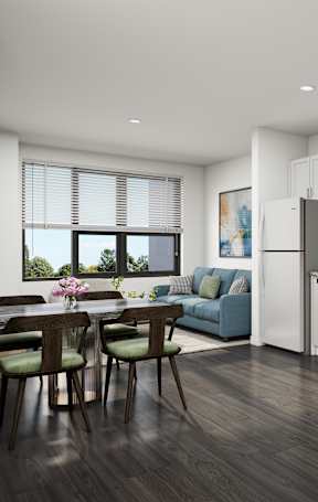 A modern kitchen with white cabinets and a dining table with chairs.