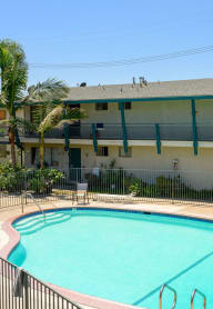 Swimming Pool a swimming pool with a building in the background
