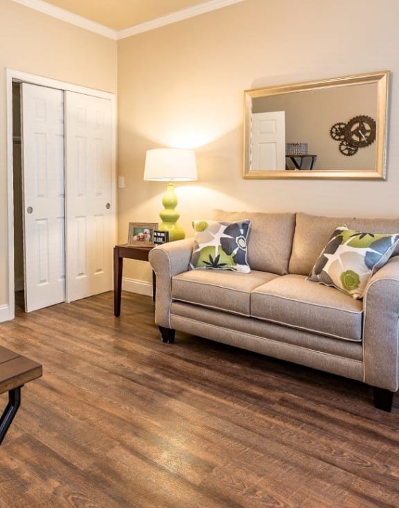 a living room with a couch and a desk