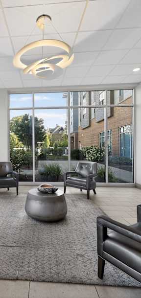 A sunny day in the living room with a view of the street.
