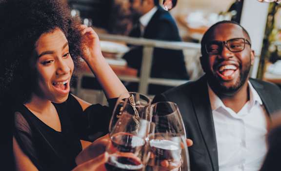 group of people drinking wine at a restaurant at Metro Crossing Apartments, Owings Mills, MD