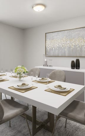 a dining room with a white table and chairs