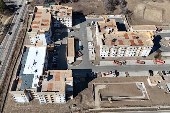 an aerial view of a building under construction in a city