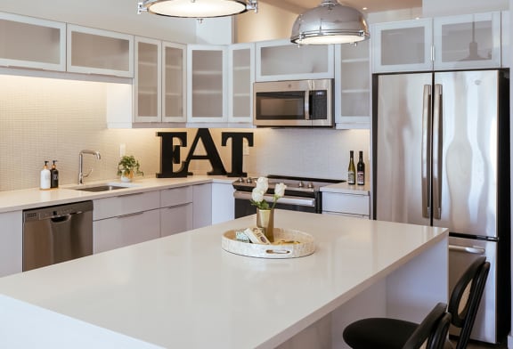a kitchen with an eat sign on the wall at Sky on Main in Missouri
